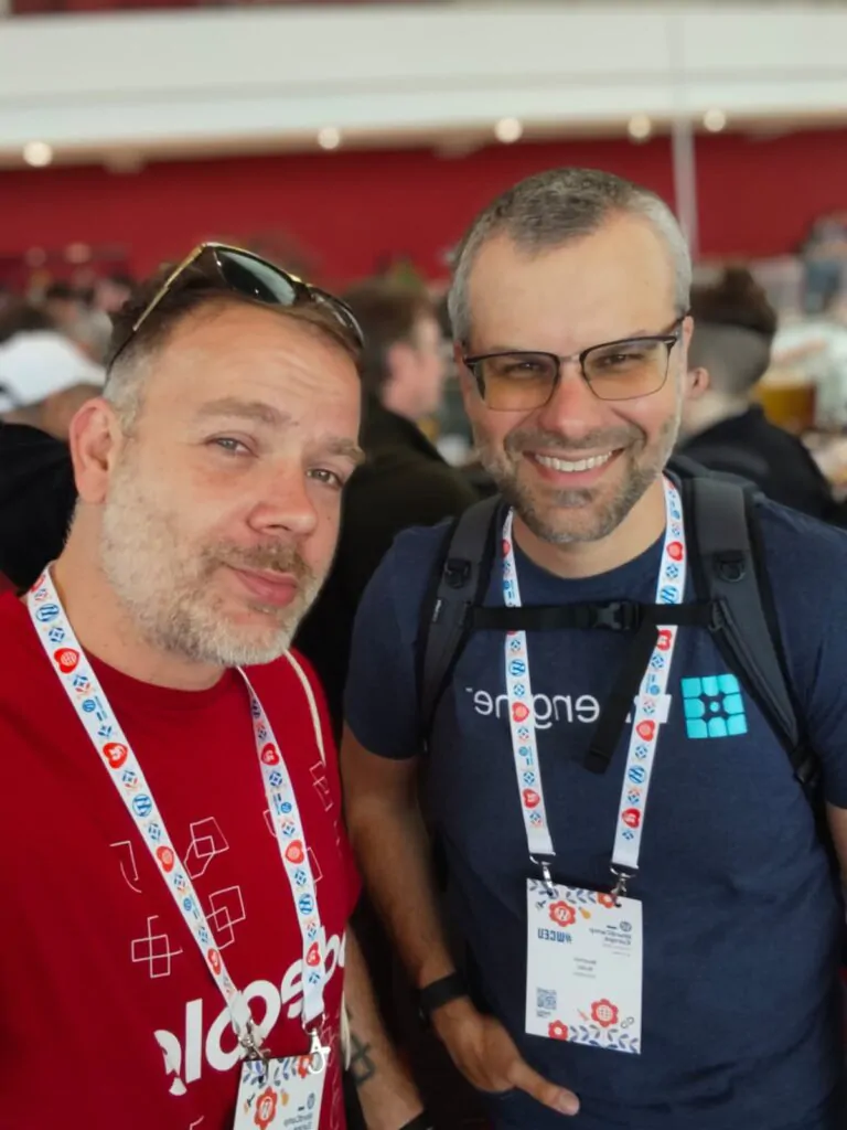 Two men standing together, one of them Weston Ruter from WP Engine